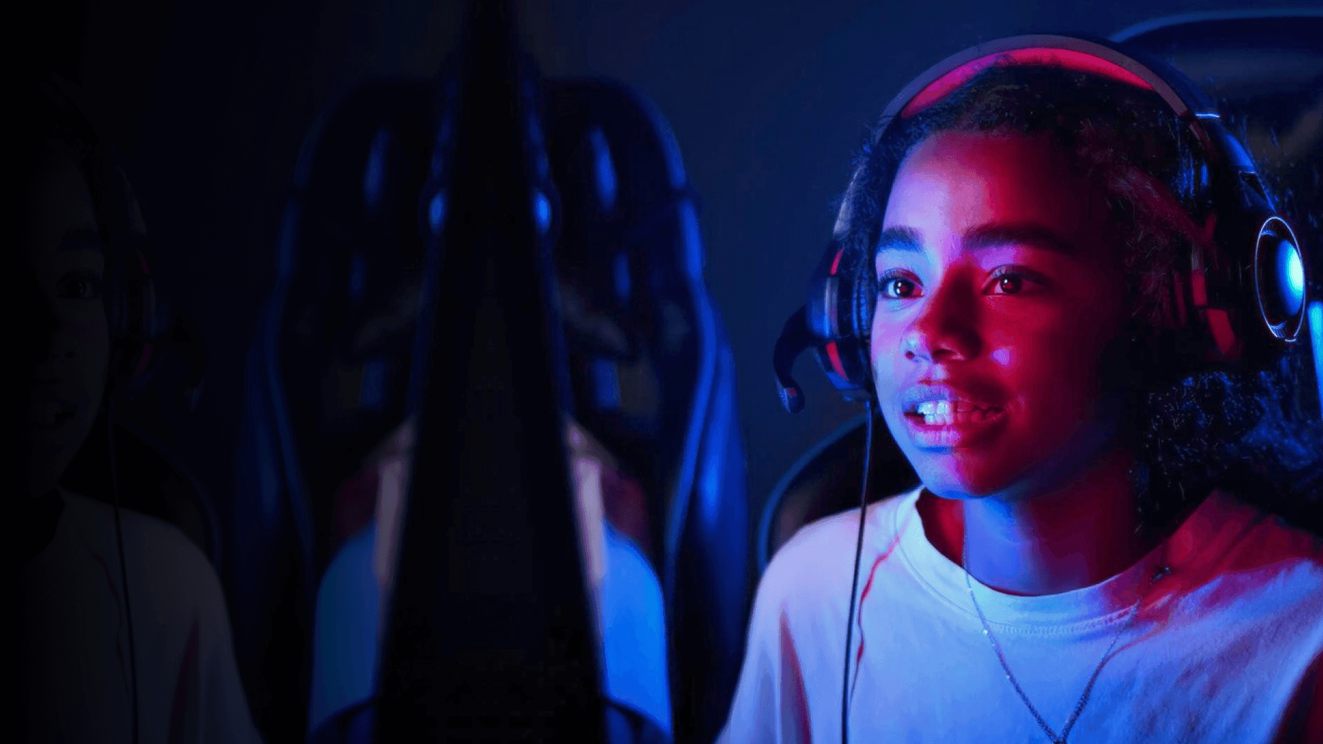 Guy wearing headphone and playing game